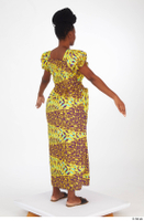  Dina Moses A poses dressed standing whole body yellow long decora apparel african dress 0006.jpg